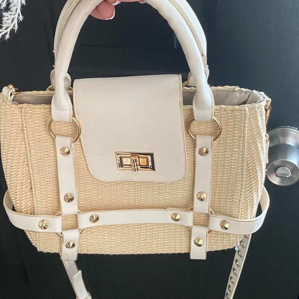 Cream and white woven bag with studded detailing and gold hardware